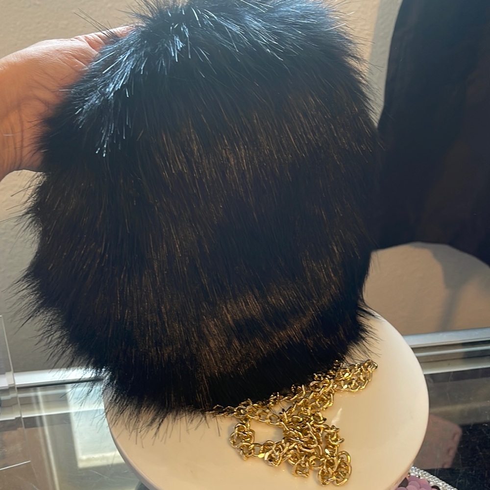 Black furry bag gold chain accent